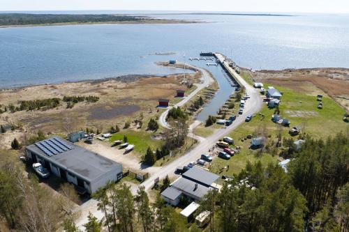 an aerial view of a parking lot next to the water at Lõunaranna Harbour Accommodation in Simisti