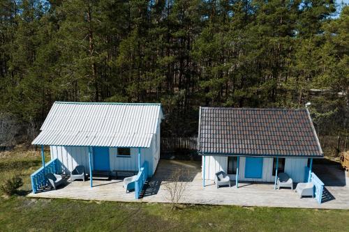 an overhead view of a blue house with chairs at Lõunaranna Harbour Accommodation in Simisti