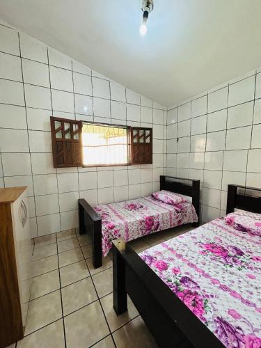 เตียงในห้องที่ Casa Mandacaru Espaço completo