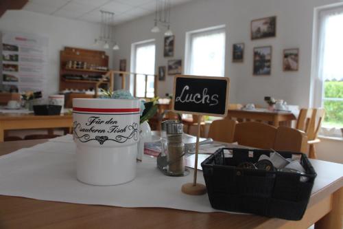 a table with a sign that says littles on it at REGIOHOTEL Aparthotel Wernigerode in Wernigerode