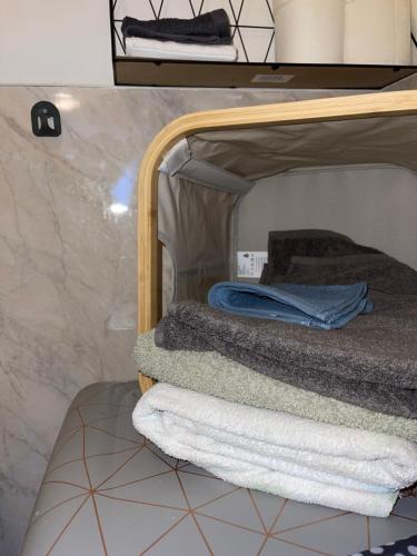 a bathroom with a bunk bed with towels on it at Crescent Loft Apartment - 1 Bedroom in Goodmayes