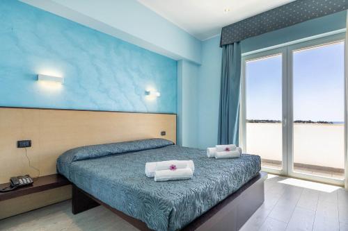 Cama o camas de una habitación en Jonico Hotel