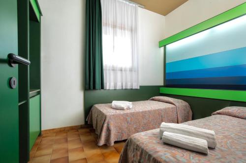 Fotografie z fotogalerie ubytování Ecovillage with swimming-pool surrounded by greenery, apartments with air conditioning and outdoor private area v destinaci Teulada
