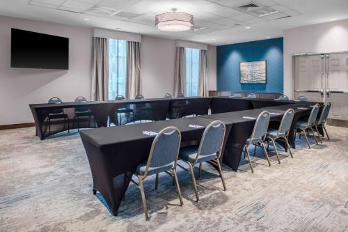 a conference room with a long table and chairs at Hilton Garden Inn Charleston / Mt. Pleasant in Charleston