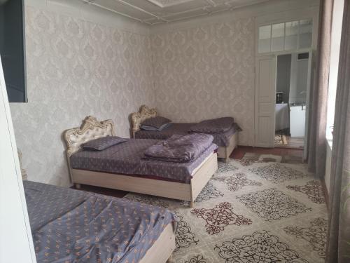 Ένα ή περισσότερα κρεβάτια σε δωμάτιο στο Guest house Шуро 7