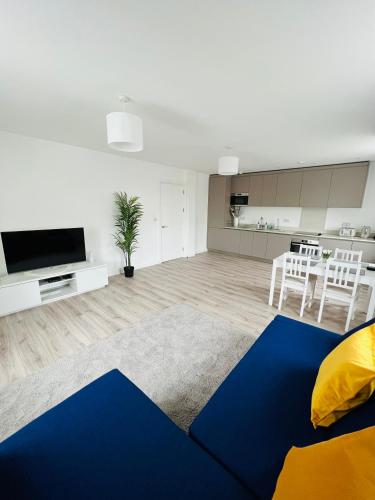 a living room with a blue and yellow rug at Stunning New Penthouse Apartment in Southend-on-Sea