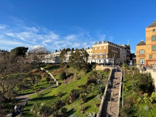 a view of a city with buildings and a hill at Stunning New Penthouse Apartment in Southend-on-Sea