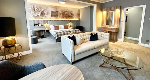 a living room with a couch and a bed at Blarney Woollen Mills Hotel - BW Signature Collection in Blarney