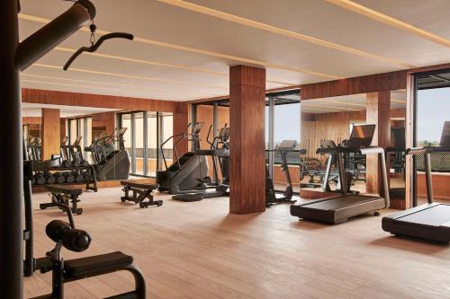 a gym with treadmills and ellipticals in a building at Park Hyatt Marrakech in Marrakech