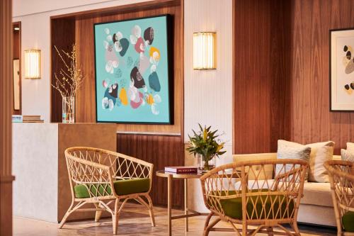 a living room with two chairs and a table at Park Hyatt Marrakech in Marrakech