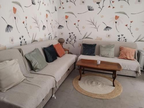 a living room with two couches and a coffee table at Masa in Baošići