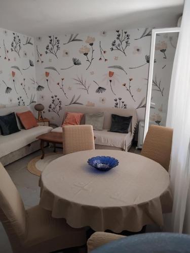 a living room with a table and a couch at Masa in Baošići