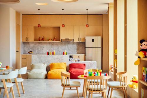 a kitchen with a couch and a table and chairs at Park Hyatt Marrakech in Marrakech