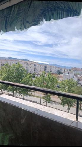 a view of a city from a window at Piso en Estación de buses in Granada