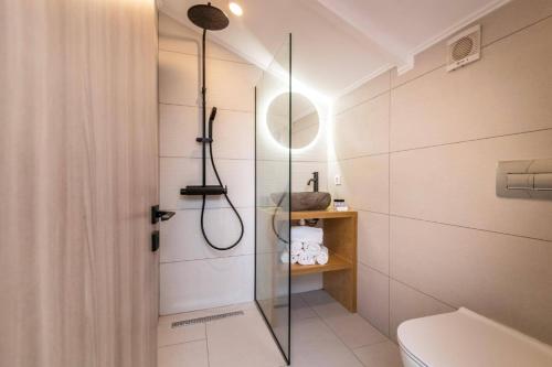 a bathroom with a shower and a toilet in it at Villa Zante Pnoe by Villa Plus in Pandokrátor