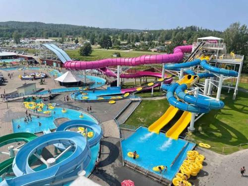 an aerial view of a water park with a water slide at Utsikten - Ny flott hytte, Privat Badstue, Spabad! in Torsby