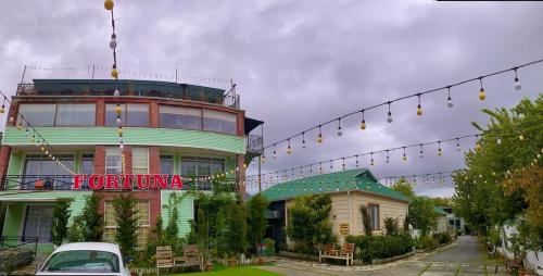 a building with a forume sign on the side of it at Gabala Boutique Hotel in Gabala