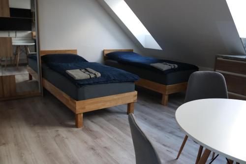 Llit o llits en una habitació de SK Apartments