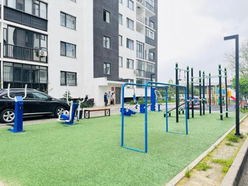an empty playground in a city with a car at Гостевой Хаб у Сайрана 8 спальных мест у автовокзала in Almaty