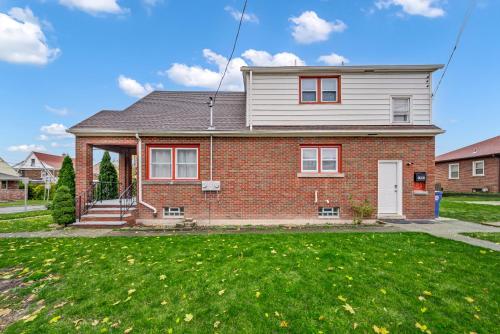 a brick house with a lawn in front of it at Best S T R in Niagara Falls NY in Niagara Falls