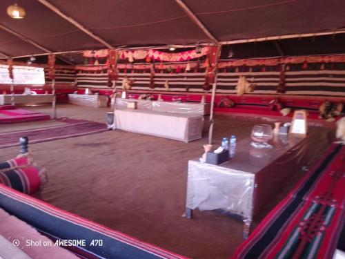 a stage with a white table in a theatre at Milky Way Bedouin Camp in Wadi Rum