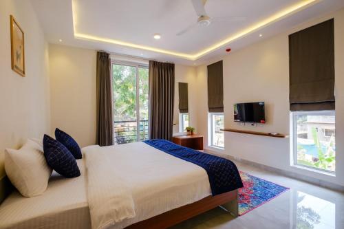 Ένα ή περισσότερα κρεβάτια σε δωμάτιο στο Eden Villas by Incred Stays 4 BHK Pvt Pool Villa, Calangute, North Goa