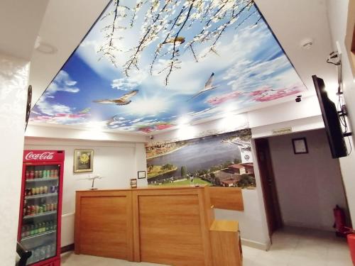 a room with a coca cola soda shop with a ceiling mural at İHVA HOTEL PİERRELOTİ in Istanbul