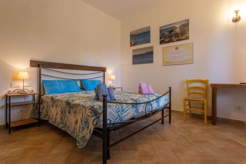 Ένα ή περισσότερα κρεβάτια σε δωμάτιο στο Casa Vacanze Punta Ferruccio