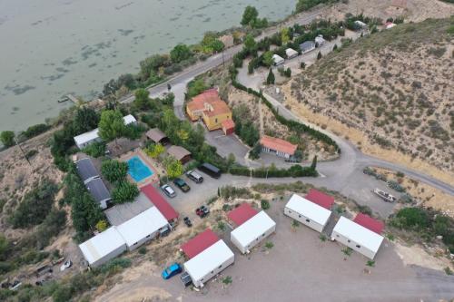 an aerial view of a group of buildings on a hill at Fishers Paradise am Ebro Mequinenza Zaragoza in Mequinenza