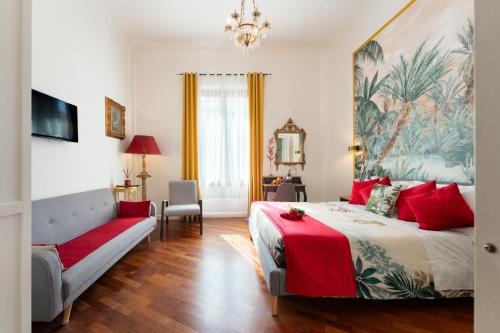 a bedroom with a large bed and a couch at Entire flat with 6 Rooms & 6 Bathrooms, 210 SQMs at Most Historical Center with LIFT !!! in Florence