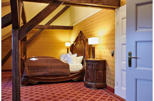 a bedroom with a bed in a room at Bernsteinschloss in Wendorf