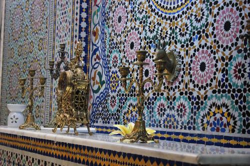 a counter with a bunch of items on a wall at Majliss Hotel Downtown in Rabat