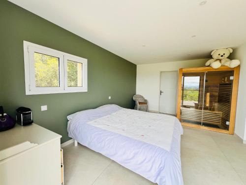 Voodi või voodid majutusasutuse Villa avec vue exceptionnelle toas