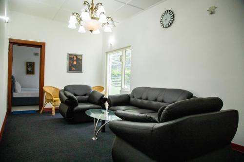 Un lugar para sentarse en Cozy Nest Lodge