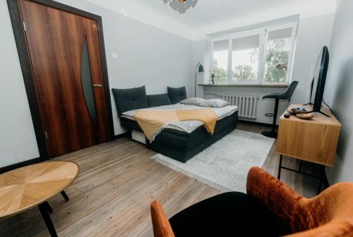 Ένα ή περισσότερα κρεβάτια σε δωμάτιο στο Cozy apartment in city center