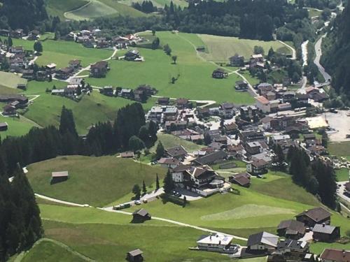 a small village in a green field with houses at Gast- und Ferienhof Christler in Tux