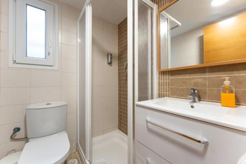 a bathroom with a toilet and a sink and a shower at CT 297 AL - Faro's Villa Las Arenas - San José in Níjar