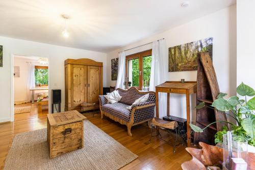 a living room with a couch and a table at Kiwi Retreat in Bad Urach