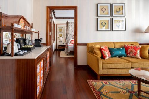 a living room with a couch and a table at The Grand Dragon Ladakh in Leh