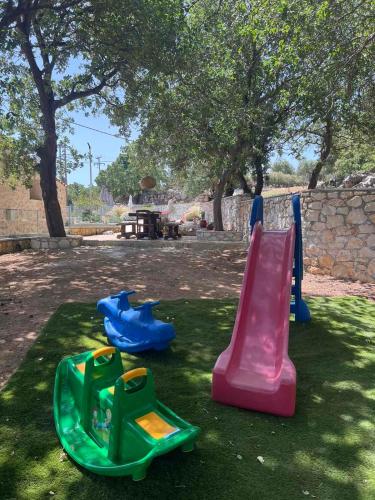 a group of play equipment in a park at Mouria Country House in Gállos