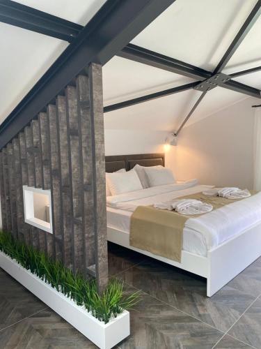 a bedroom with a large bed in a room at KUCA URLA in Urla