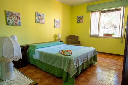 Ένα ή περισσότερα κρεβάτια σε δωμάτιο στο Villa Mariuccia