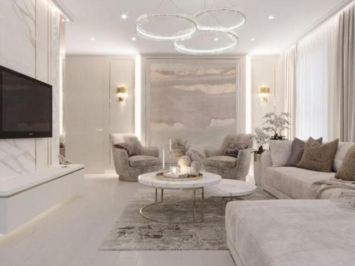een witte woonkamer met een bank en een tafel bij Luxary Home VIP Flora inn in Baku