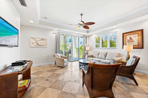 a living room with a couch and a table at A Somewhere is Here by Beachside Management in Siesta Key