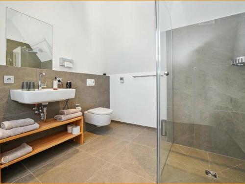 a bathroom with a sink and a shower at Hotel Landlust St. Martin in Sankt Martin