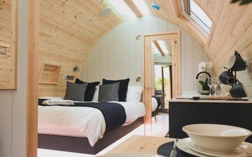 a bedroom with two beds in a room at Primrose Glamping Pods in Ingleton 