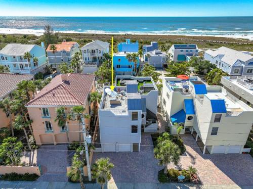an aerial view of houses and the beach at Coastal Surfside By Beachside Management in Siesta Key