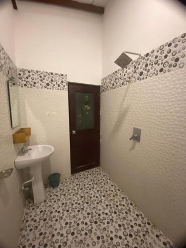 a bathroom with a sink and a toilet at Bloom Star7 in Unawatuna