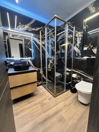 a bathroom with a sink and a toilet in a room at Atico LUXURY Magic World in Oropesa del Mar
