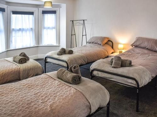מיטה או מיטות בחדר ב-The Sands